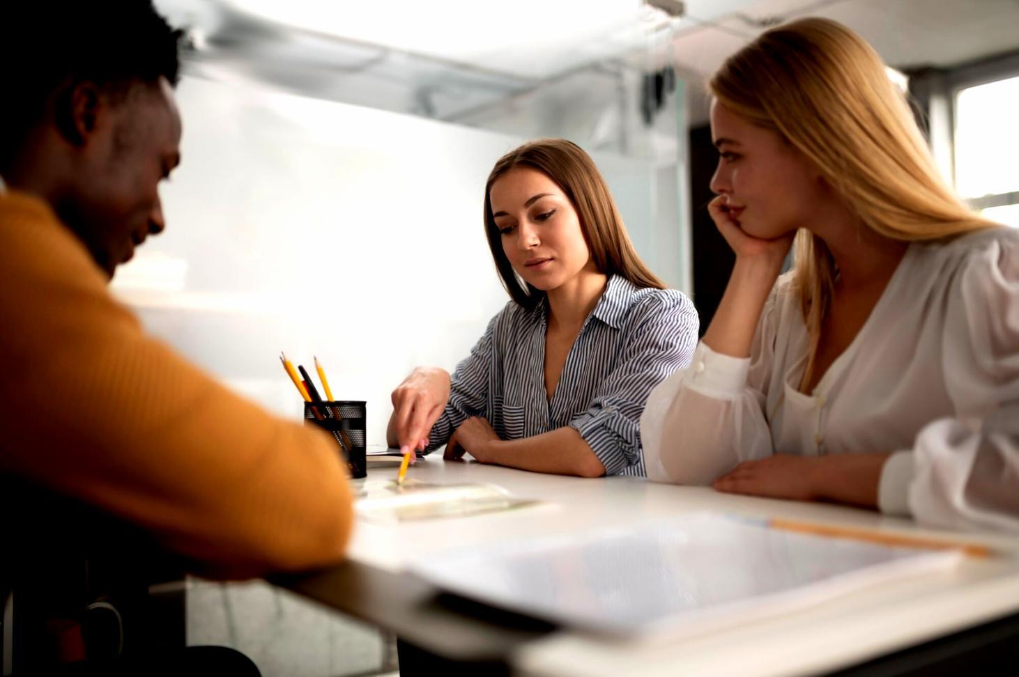Person reviewing financial documents at desk
