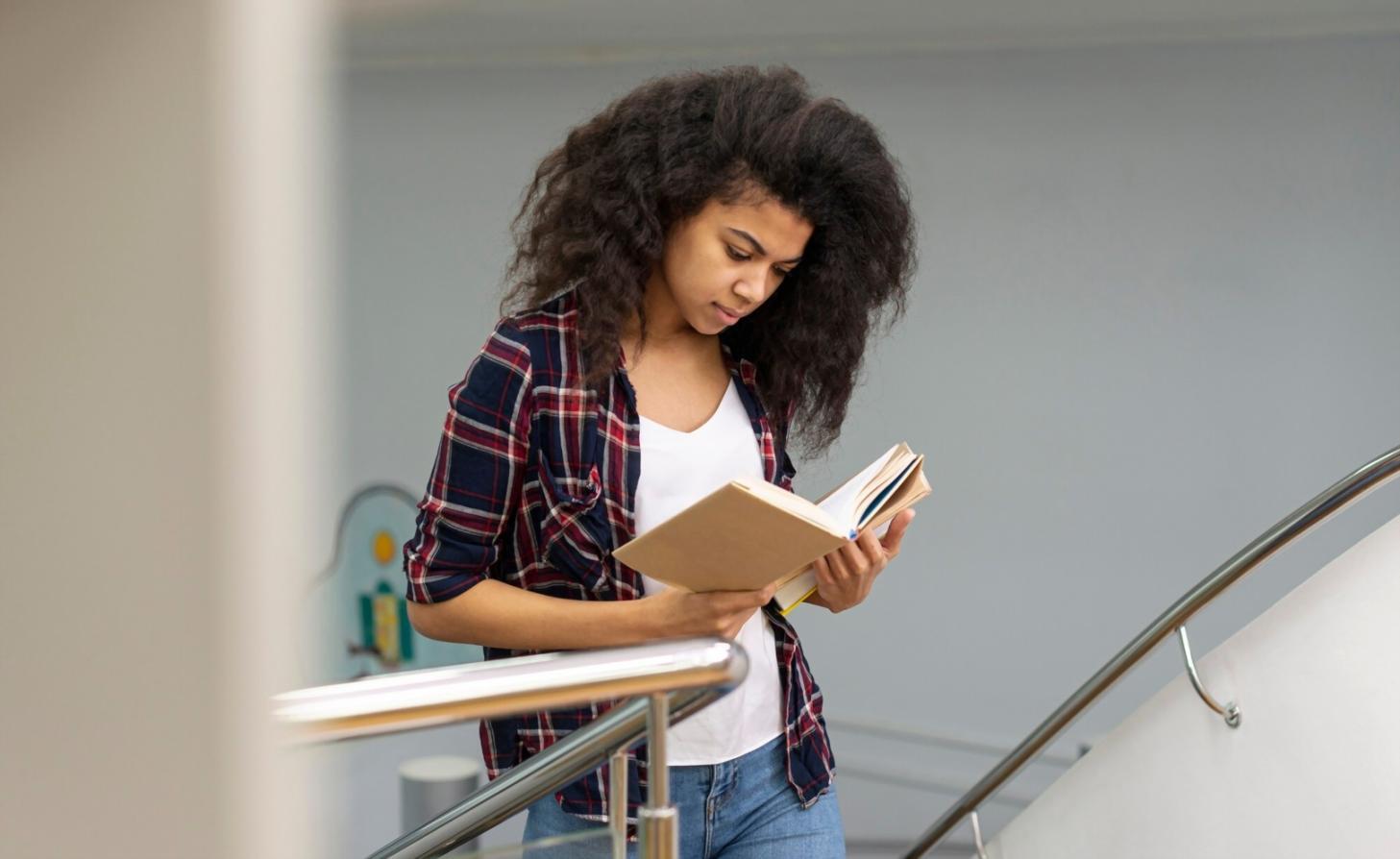Person reviewing financial documents and budgeting worksheets at desk