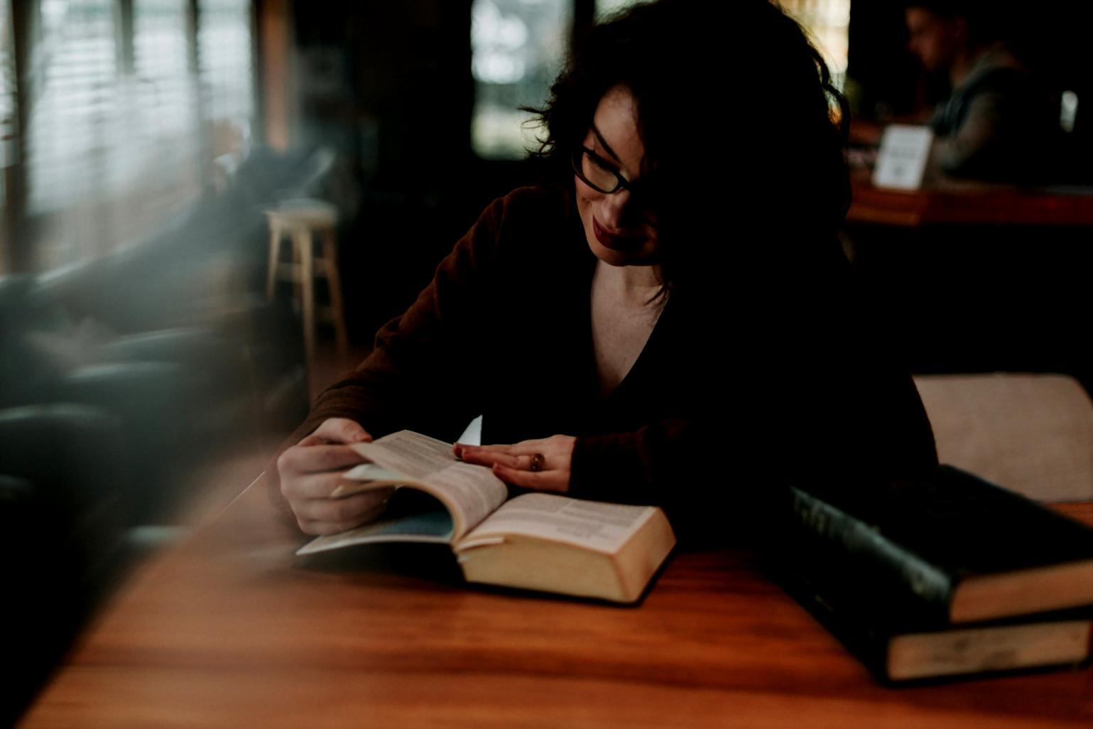 Person reviewing financial documents and receipts on a desk